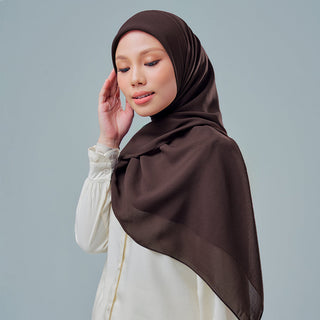 Nisa 2.0 in Carafe Signatures by TudungPeople, stylish hijab in a sleek carafe design, displayed on a plain background.