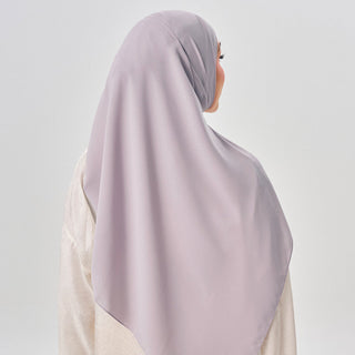 Niya Chiffon 2.0 instant hijab in Foggy by TudungPeople, showcasing the soft, lightweight chiffon fabric in a muted gray shade.