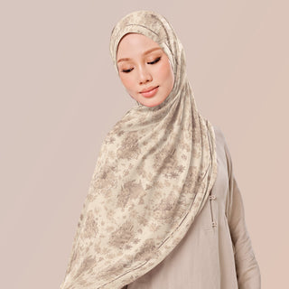 TudungPeople Kasturi print hijab in soft shades, featuring intricate floral patterns on lightweight fabric.