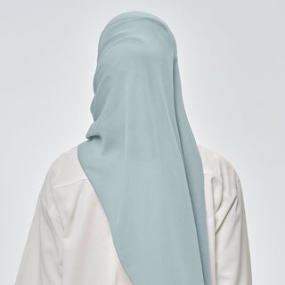 Suri in Mermaid signature hijab by TudungPeople featuring a vibrant mermaid-inspired design with intricate details.