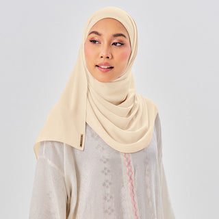 Niya Chiffon 2.0 instant hijab in Parmesan color by TudungPeople, showcasing the lightweight, flowy chiffon fabric.