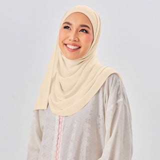 Niya Chiffon 2.0 instant hijab in Parmesan color, lightweight and breathable TudungPeople headscarf on a plain background.