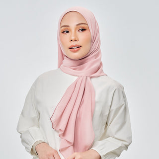 TudungPeople Suri Signature hijab in pink lemonade fabric, showcasing its stylish design and vibrant color.