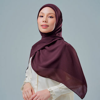 TudungPeople Nisa 2.0 Signatures velvet hijab in prune color, showcasing elegant, soft fabric with a smooth finish.