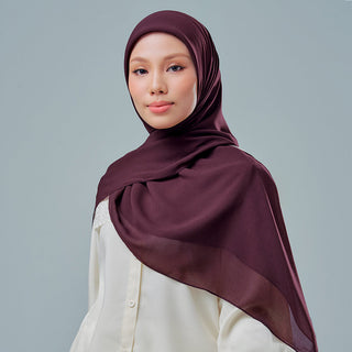 TudungPeople Nisa 2.0 Signatures in velvet, prune color, showcasing the stylish hijab with smooth fabric and elegant drape.
