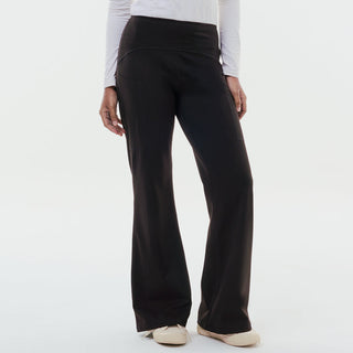 Black TudungPeople straight active pants displayed on a hanger, showcasing their slim fit and comfortable athletic design.
