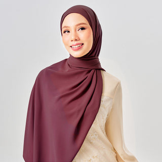 Niya Chiffon 2.0 TudungInstant in Sangria color, lightweight chiffon hijab with soft drape, styled for everyday wear.