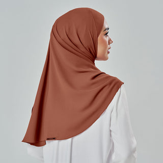 Niya Chiffon 2.0 TudungPeople instant hijab in Syrup color, soft chiffon fabric displayed in a neatly folded style.