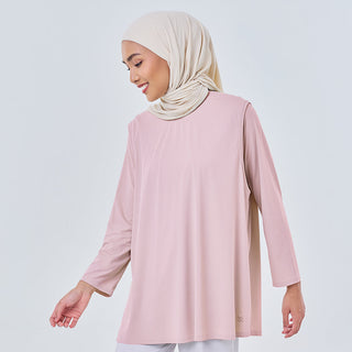 Pink Dryfit tank top from TudungPeople, apparel for active wear, shown on a hanger with a fitted style and sleeveless design.