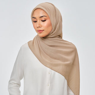 TudungPeople Suri in Trail signature hijab, featuring a stylish trail pattern in soft colors, displayed on a mannequin.