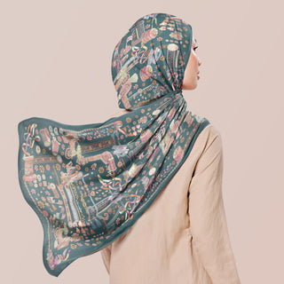 TudungPeople Atelier teal print featuring elegant design on a fabric print for stylish headscarves.