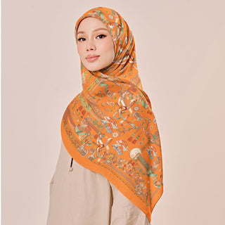 Warm orange Atelier print from TudungPeople, featuring vibrant colors and intricate details on high-quality fabric.