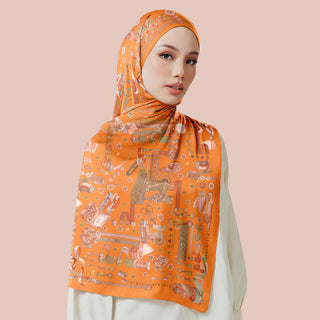 Warm orange print by TudungPeople from the Atelier collection, featuring vibrant, artistic design on fabric.