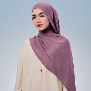 Elegant TudungPeople Signatures modal fabric with a tulip pattern, showcasing soft, flowing material in vibrant floral design.