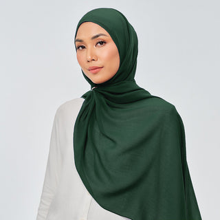 TudungPeople Suri in Verdant signature hijab displayed in vibrant green fabric with intricate details.